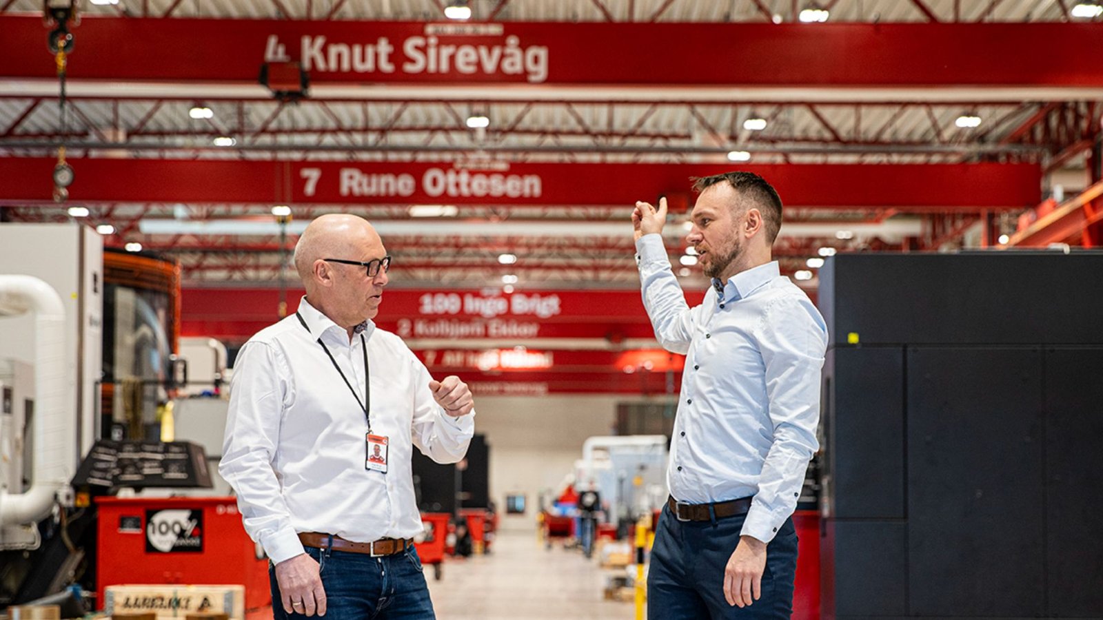 Inge Brigt Aarbakke and Odd Magne Vea standing in the middle of Aarbakke Smart Factory production hall