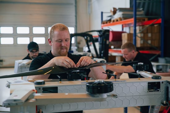 Employee at Griff Aviation working on a drone