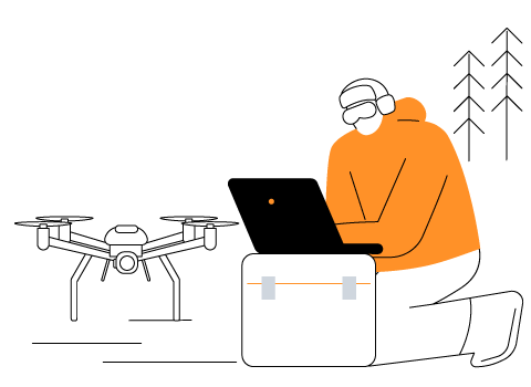Person using computer to give instructions to drone