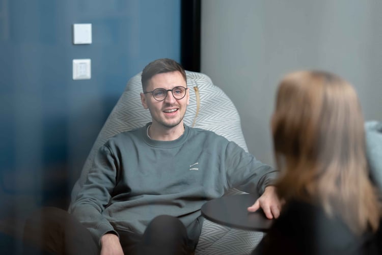 Two people talking in a meeting room